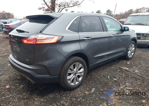 2022 Ford Edge Titanium z USA, uszkodzony, nr VIN 2FMPK4K90NBA35277